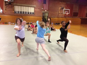 Dancers find a moment of pause.